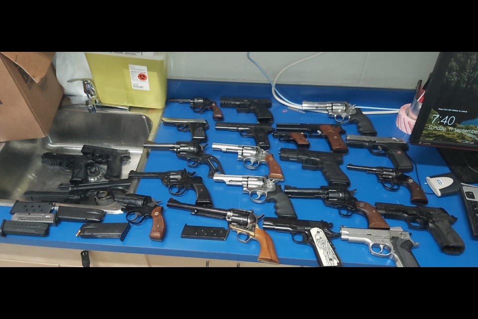 Strathmore RCMP seized dozens of guns and ammunition after a road rage incident earlier this month.