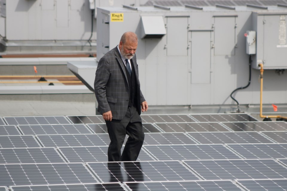 Mayor Peter Brown admires the new solar system on the roof of Genesis Place Recreation Centre. The system, according to the City, is the largest municipal rooftop solar system in Canada.
Photo by Nathan Woolridge/Rocky View Publishing