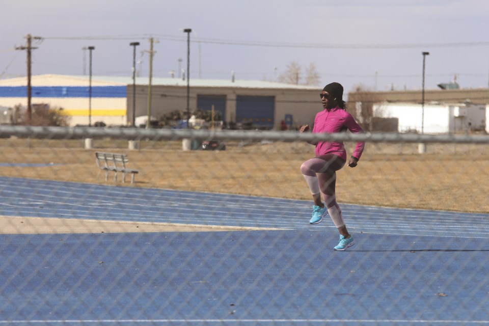 An athlete warms up on the track at Ed Eggerer Athletic Park on a recent Sunday afternoon.