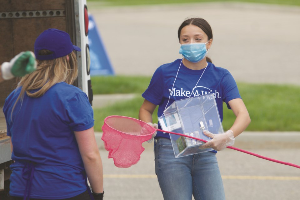 The Southern Alberta chapter of Make-A-Wish Canada hosted the Great Quarantine Clean Up at CrossIron Mills mall June 13 and 14. The drive-thru recycling event raised funds by collecting electronics, bottles, clothing and paper, along with cash donations.
Photo by Ben Sherick/Airdrie City View