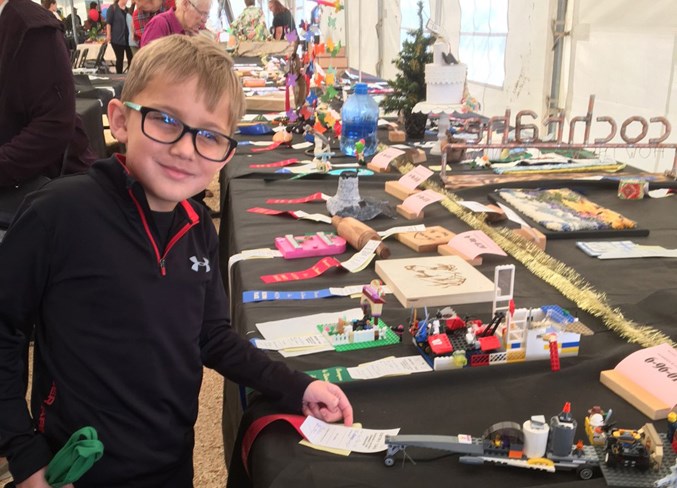 Bearspaw Old Tyme Country Fair attendee Mason Britton enjoyed checking out the available wares at the 50th anniversary of the annual event in August 2018.
File Photo/Rocky View Publishing 