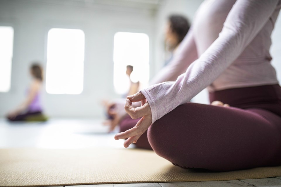 Practicing yoga is one example of a technique for reducing stress during the holidays. Photo: Metro Creative Connection
