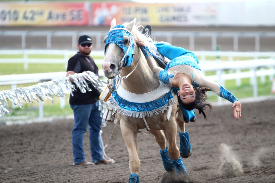 Bella Da Costa, 12, shows off her trick-horseback-riding skills Aug. 25, in the lead-up to the final day of racing at the World Professional Chuckwagon Association's championship finals.
Photo by Scott Strasser/Rocky View Publishing