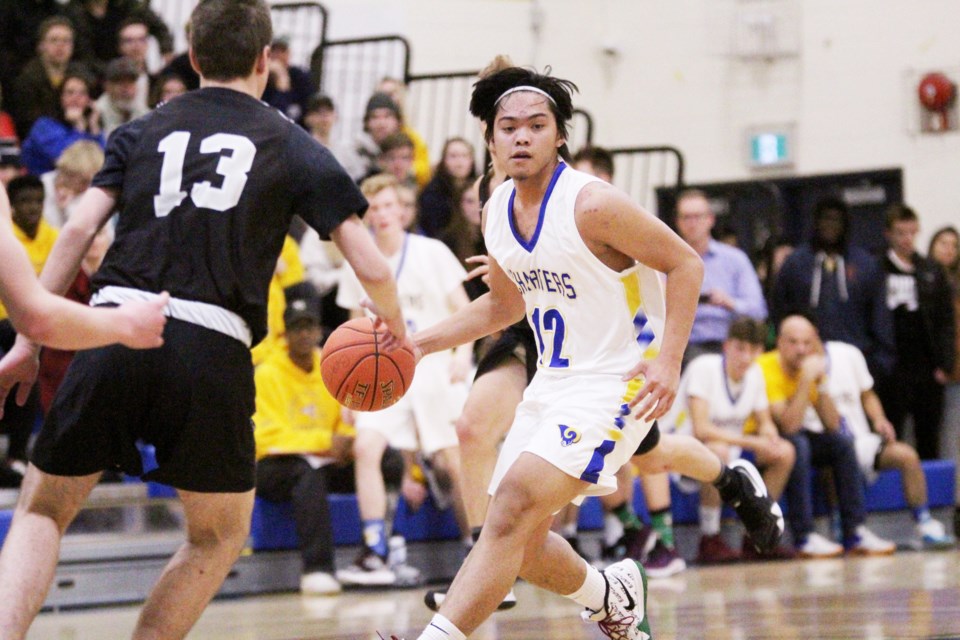 The Bert Church Chargers senior boys' basketball team defeated the George McDougall Mustangs Dec. 4, kickstarting the 2019-20 season with a win over its crosstown rival, in front of a large and passionate crowd. Photo by Scott Strasser/Rocky View Publishing