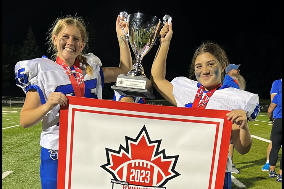 Langdon's Hannah Franssen (left) and Chestermere's Amira Harb played for Alberta's U18 female tackle football team, which won national gold on July 30.