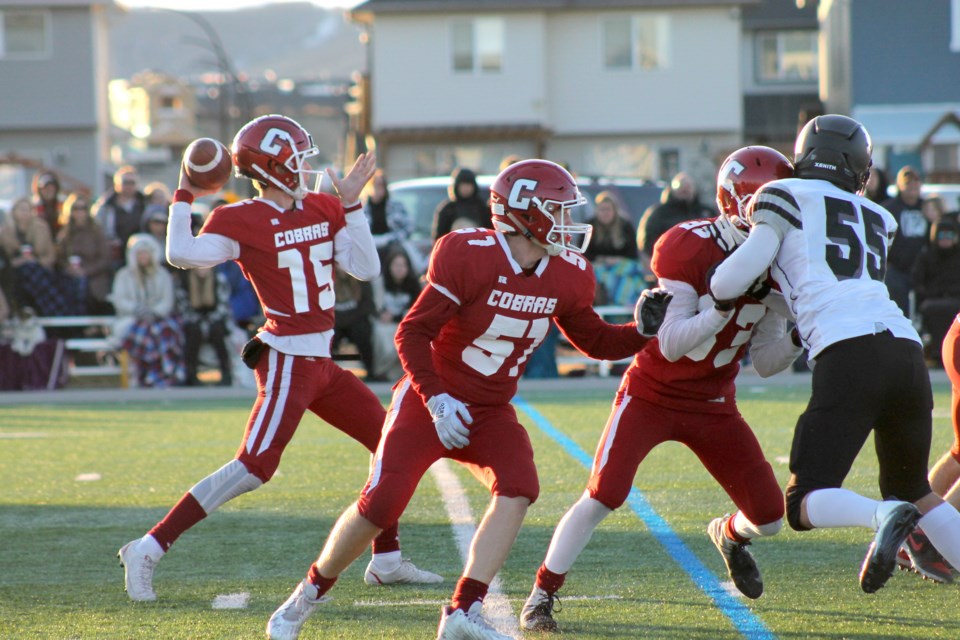 The Cobras quarterback looks for teammates during the Oct. 28 RVSA final.