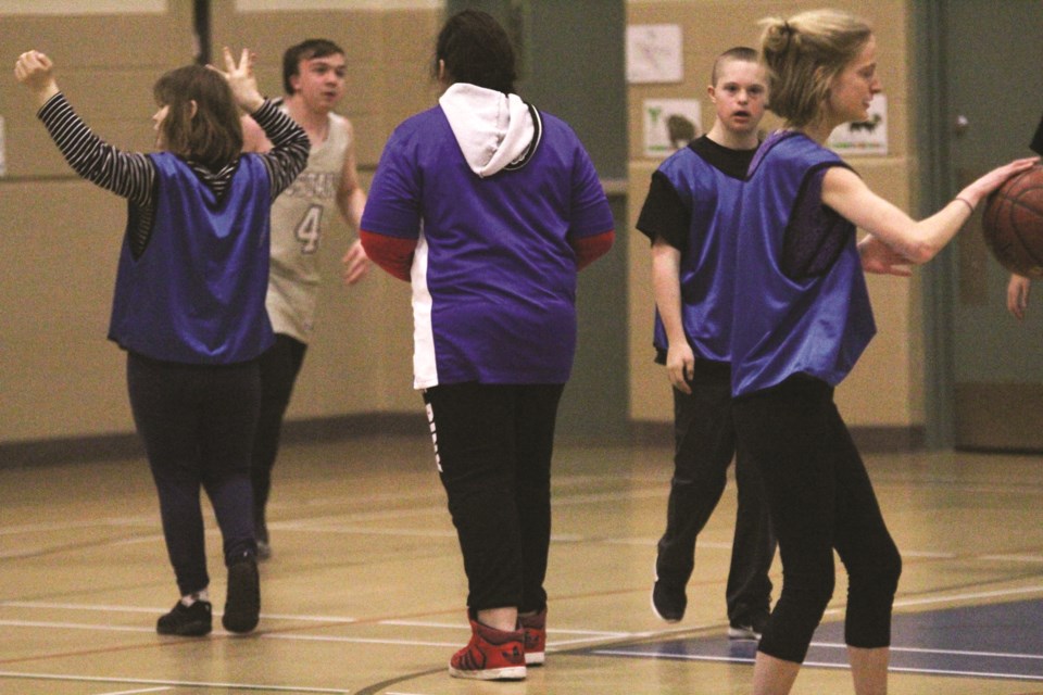 Pamela is Special Olympics Airdrie's Athlete of the Month for January. The 23-year-old, whom SOA asked not to be photographed from the front, has enjoyed participating in the organization's basketball program this winter. Photo by Scott Strasser/Airdrie City View