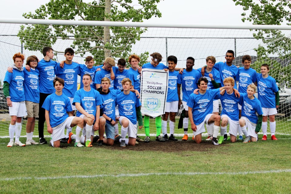 The Springbank Phoenix senior boys' soccer team poses with the RVSA banner June 6 after defeating the Bert Church Chargers 1-0 in the championship game. 
Photo by Scott Strasser/Rocky View Publishing