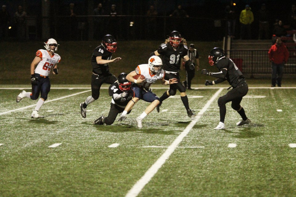 The Airdrie Raiders booked a spot in the CSFA Division 2 final with a 19-13 win May 23 over the Calgary Wildcats. Pictured: Mateo Gramaglia (No. 54) brings down a Wildcats player in the third quarter. 
Photo by Scott Strasser/Rocky View Publishing