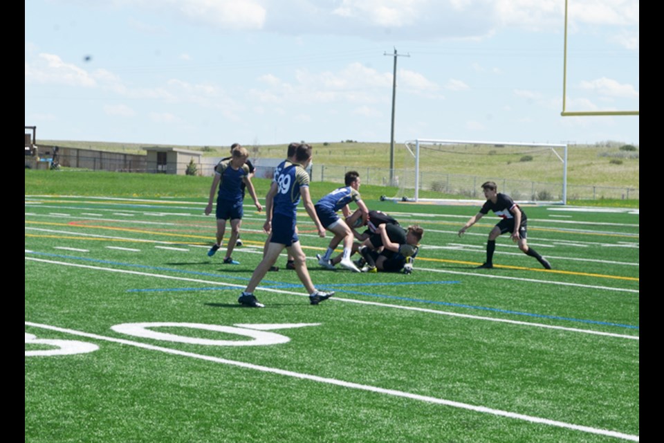 The Chestermere Lakers and the Bow Valley Bobcats square off June 4 at the RVSA rugby 7s divisional championship tournament, in Cochrane. 
Photo by Troy Durrell/Great West Newspapers