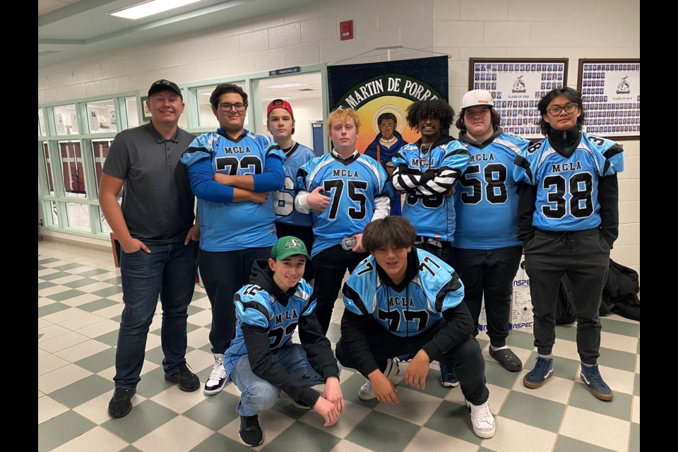 St. Martin de Porres football players pose in their jerseys on Nov. 14, before playing in the Calgary city finals that evening.