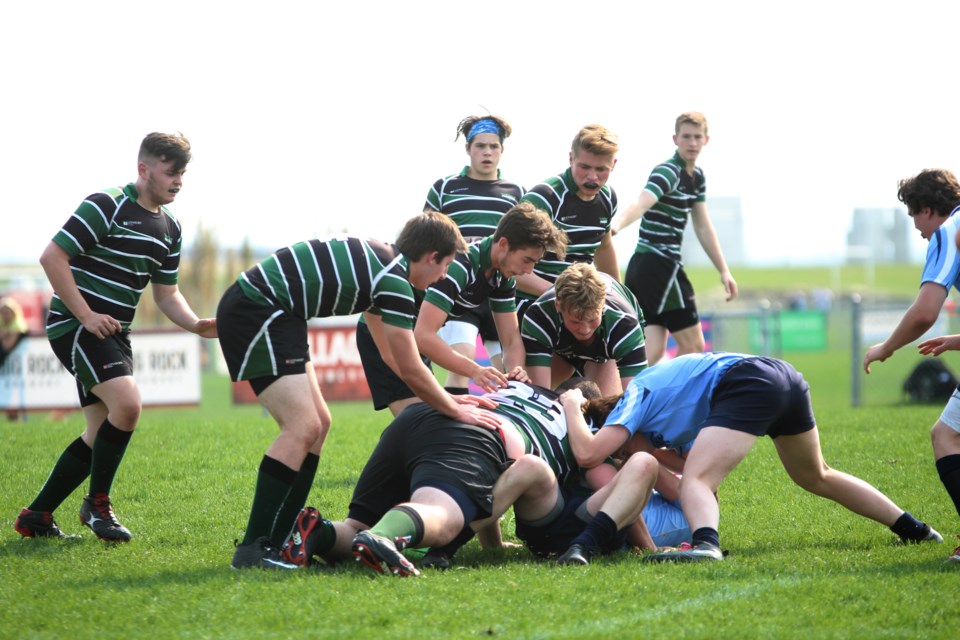 The Springbank Phoenix and the Strathcona-Tweedsmuir Spartans played to a highly competitive 29-29 result in the Big Sky high school boys' rugby league semi-final May 28. The Spartans prevailed in drop-kicks. 
Photo by Scott Strasser/Rocky View Publishing
