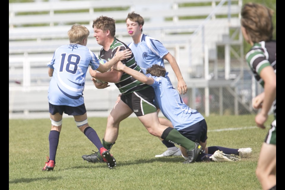 The Springbank Phoenix senior boys' rugby team won the 2022 South Central Zones Tier II banner on May 30, beating the Strathcona-Tweedsmuir Spartans 25-22.