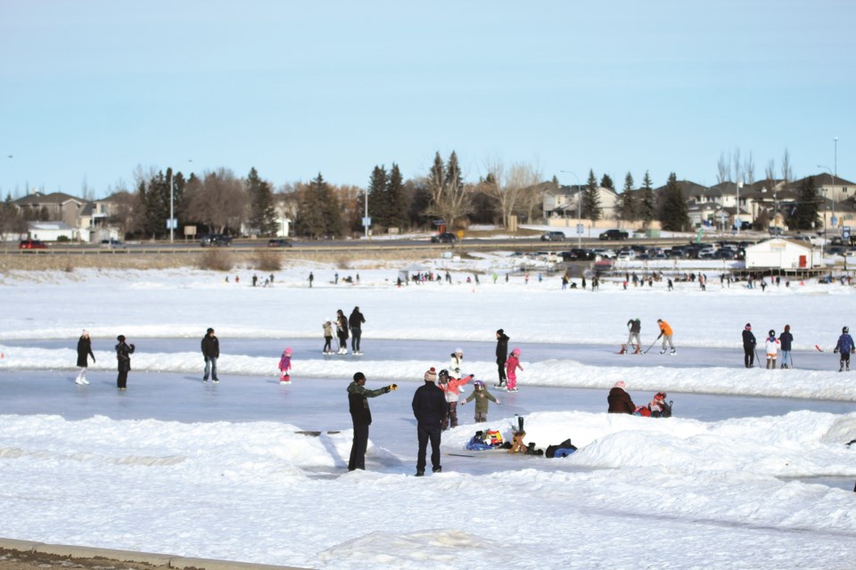 Sunny skies and mild temperatures Jan. 16 provided the perfect opportunity for some outdoor activities on Chestermere Lake, including skating, ice fishing and taking the dirtbike out for a rip.