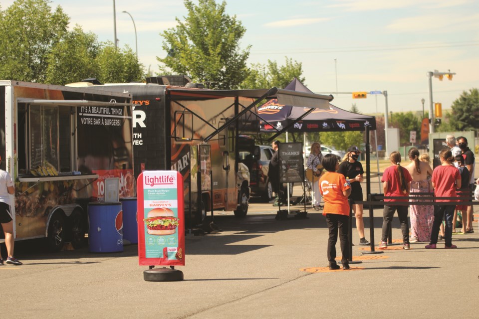 Harvey's RV Tour was at the Sobeys in Airdrie Aug. 21, where anyone interested could receive a free hamburger and pop. Photo by Scott Strasser/Airdrie City View.

