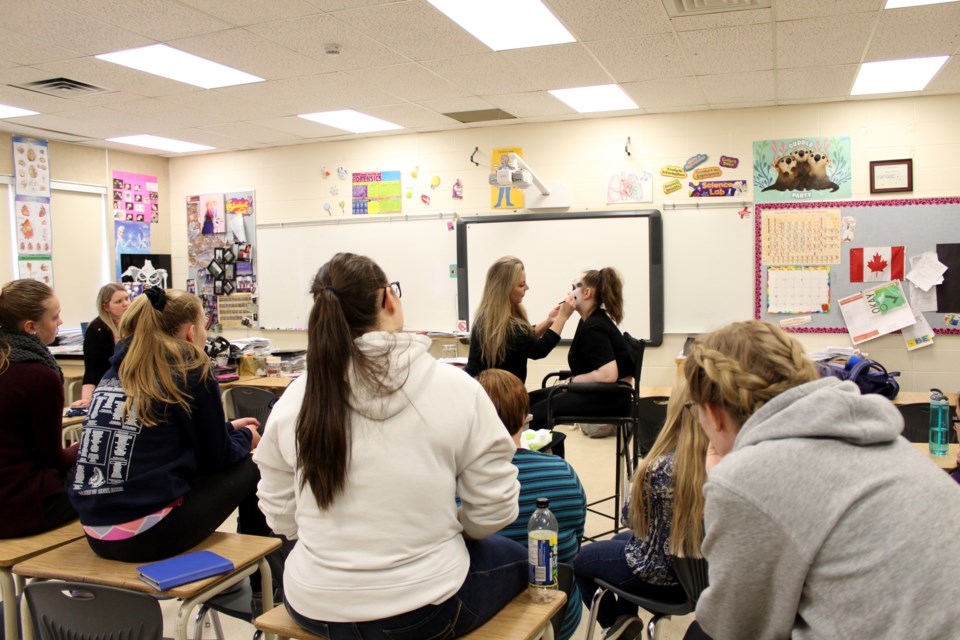 Cosmetology students at W.G. Murdoch High School in Crossfield learned from a pro May 2, during a stage makeup demonstration from Amanda Toszer. 
Photo by Scott Strasser/Rocky View Publishing