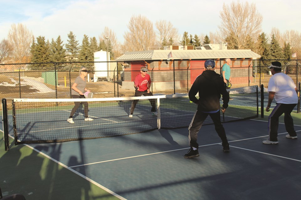 Double-digit temperatures Dec. 5 provided the perfect opportunity for outdoor activities, such as pickle ball. Photo by Scott Strasser/Airdrie City View.