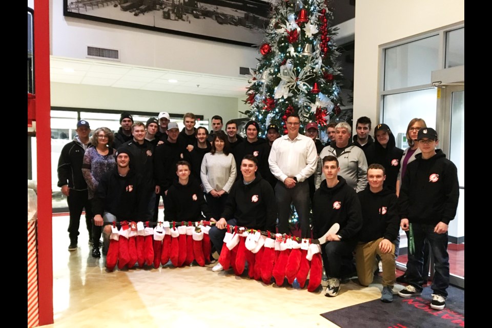 The Airdrie Techmation Thunder junior B hockey team presented North Rocky View Community Links with 26 stockings to be distributed to children and youth in Airdrie who are in need this holiday season. Photo by Scott Strasser/Rocky View Publishing