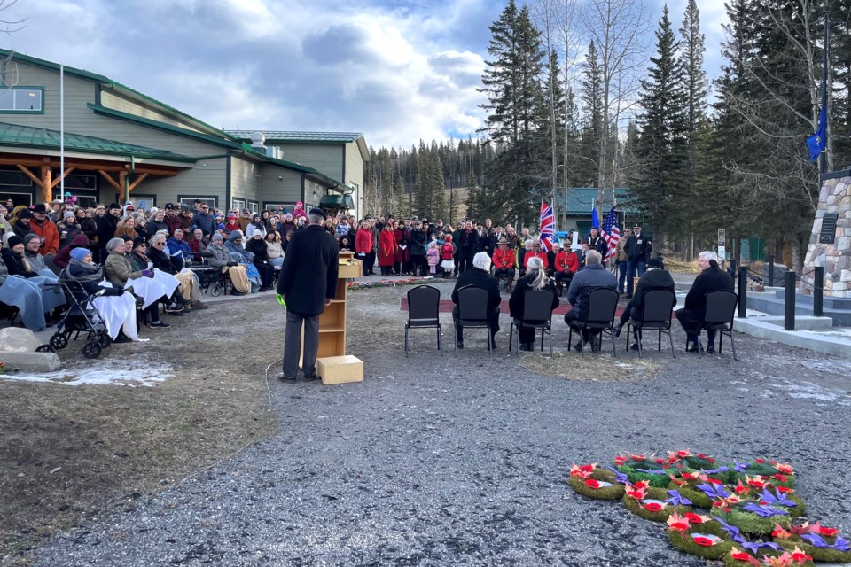 A large crowd gathered at the Bragg Creek cenotaph for a windy Remembrance Day ceremony on Nov. 11.