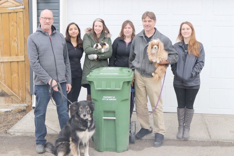 Residents can put pet waste in green organics recyling bins as of April 1. Coun. Ron Chapman with Scooter, Coun. Tina Petrow with guinea pigs Mr. Pip and Dancer and Deputy