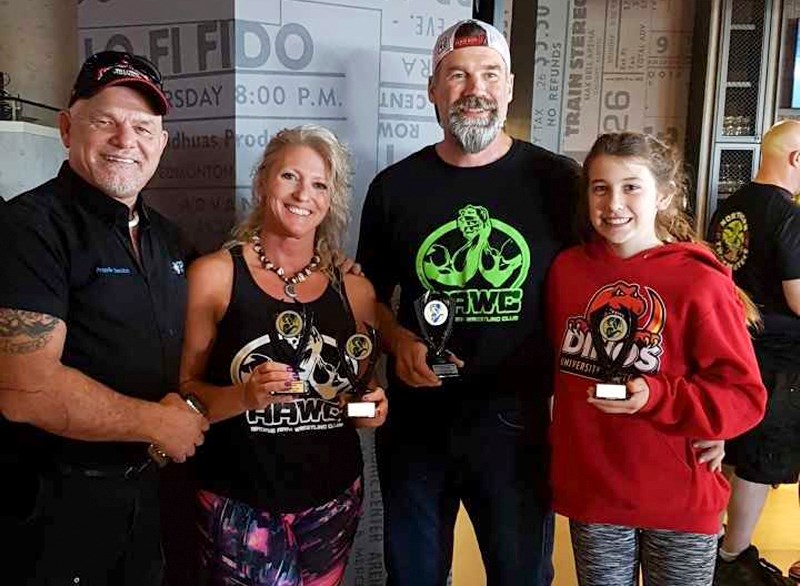 (Left to right) Airdrie Arm Wrestling Club coach Stew Foster led competitors Stacey Foster, Glenn Weber and Bella Weber to first and second place finishes at the 2018 Alberta 
