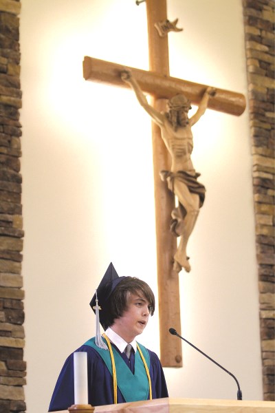 Valedictorian Jeremy Bennett gives his address during the St. Martin de Porres graduation ceremony held at St. Paul&#8217;s Church June 4. For more, see page 10.