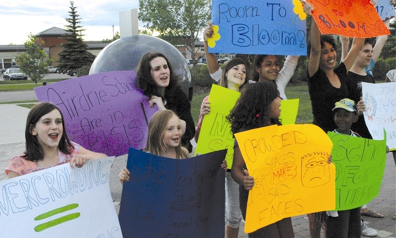 Airdrie students protest the lack of space in local schools outside of City Hall after the Airdrie Council of School Councils Forum, June 24.