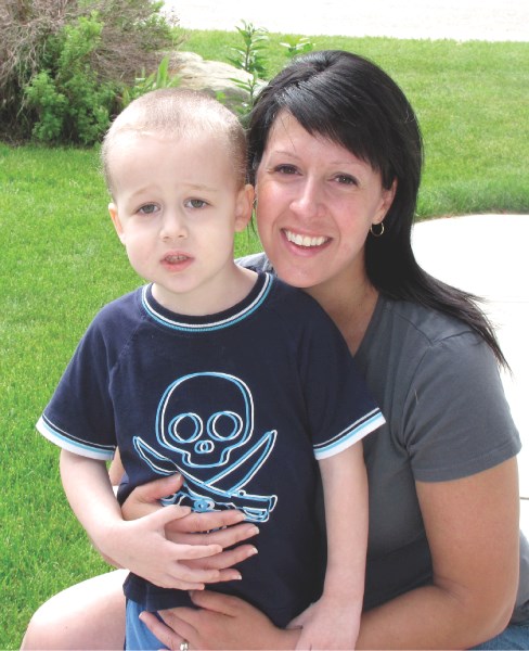 Three-and-a-half-year-old Payton Brown with his mother Amy outside their Airdrie home. Payton has been recently diagnosed with Acute Lymphoblastic Leukemia.