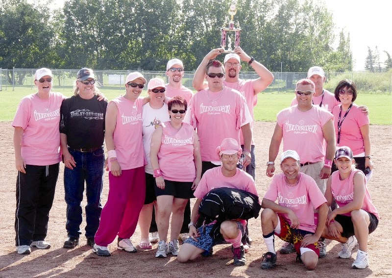 Participants in last year&#8217;s Batting Against Breast Cancer slo-pitch tournament show off their pink uniforms, while raising more than $45,000 for the cause. This