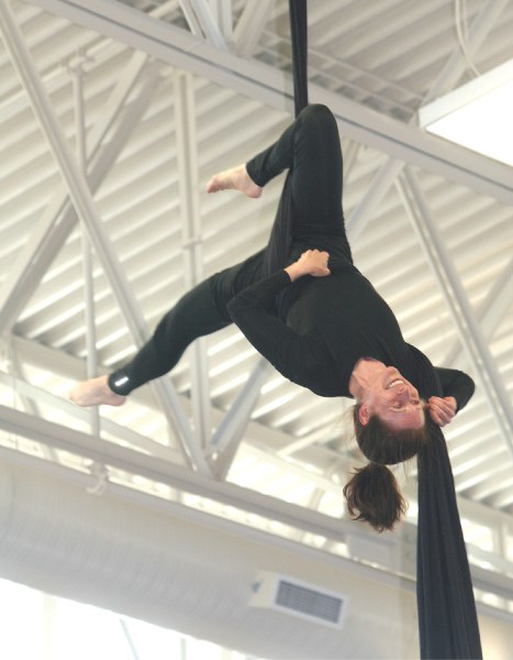 Robyn Fox, Airdrie Edge Gymnastics Club coach, performs and aerial circus routine at the club&#8217;s new training centre at Genesis Place, Aug. 23.