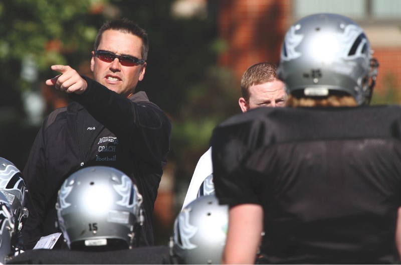 George McDougall Mustangs coach Brent Legault gives direction to his squad during a preseason practice, Aug. 31.