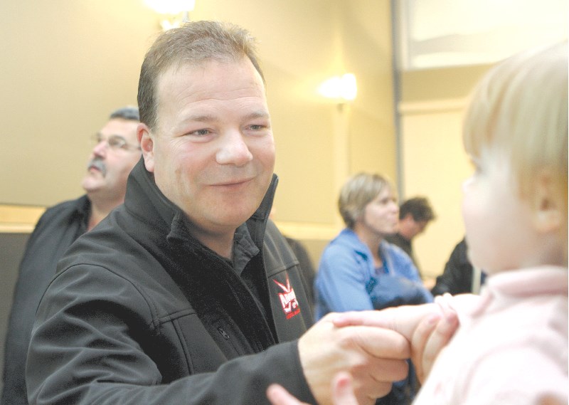 Peter Brown shakes hands with a future voter at a post-election reception at City Hall, Oct. 18. Mayor-elect Brown will be sworn into office on Oct. 25