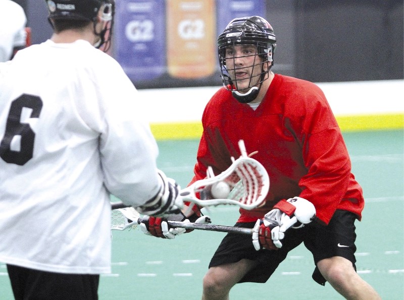 Airdrie&#8217;s Jordan Sealock runs through a defensive drill during the Calgary Roughnecks&#8217; training camp at Genesis Place, Dec. 4. The tryouts, which are open to the