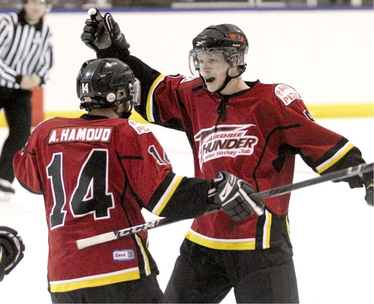 Defenceman Taylor Crossley (right) and his Airdrie Thunder have won three in a row.