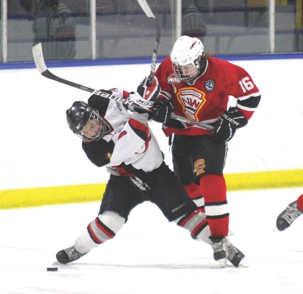 Airdrie Xtreme forward Tyler Wong took this hit from Taran Mathison and still racked up six points in his team&#8217;s 9-2 win over the Calgary Bronks, Jan. 30.