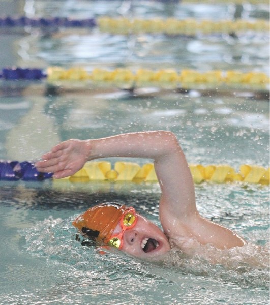 Reid Glatz, representing the Nose Creek Swim Association, won first place in five events in the inaugural John G. Timmermans Memorial Invitational, held Feb. 12-13 at