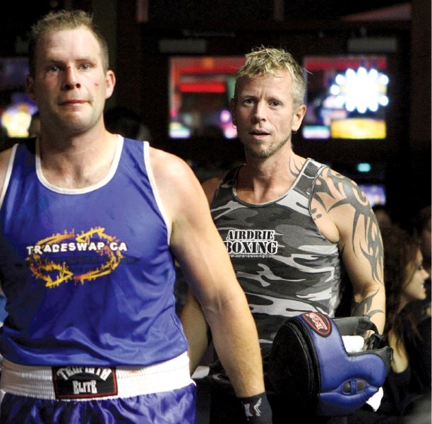 Boss Boxing coach Rhys Eckardt (right) is bringing Alberta&#8217;s top fighters to Airdrie, March 12, for Boss Brawl. The event will include more than 20 bouts and feature a