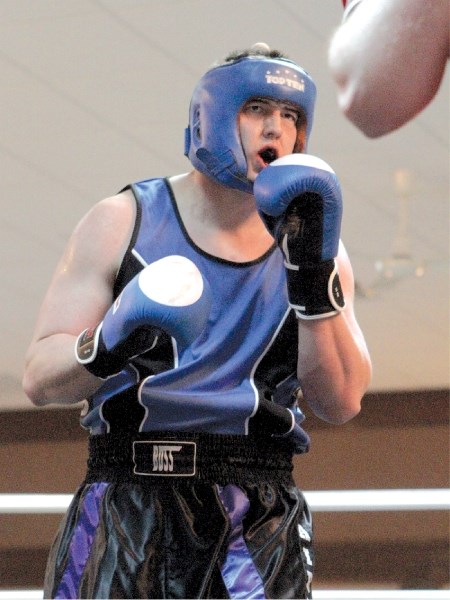 Airdrie&#8217;s Jesse Foster lines up a punch against Matt Ash from Sweet Science Boxing Gym during the inaugural Boss Brawl March 12 at the Town and Country Centre. Foster