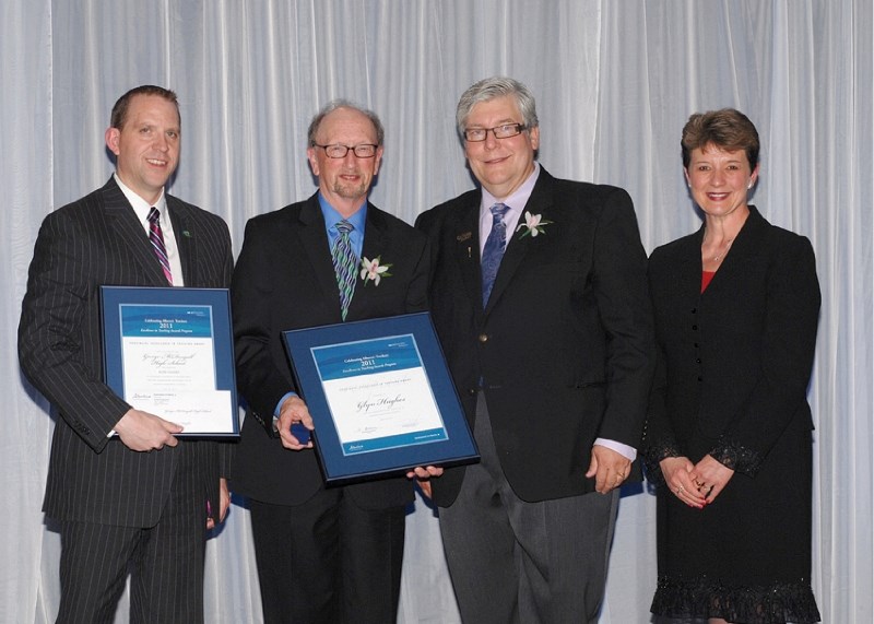 George McDougall High School Glyn Hughes (second from the left) accepts an Excellence in Teaching Award from Education Minister Dave Hancock (second from the right). Hughes