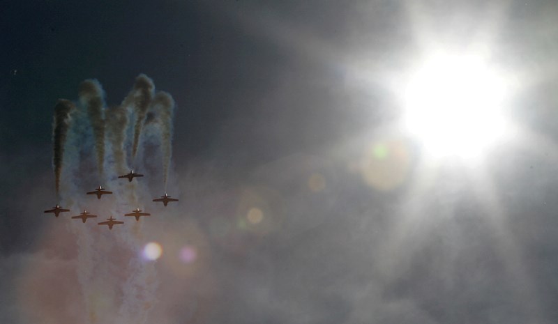The Canadian Snowbirds aerobatic team perform a loop during the first day of the Airdrie Regional Airshow, July 16 at the Airdrie Airpark. The show drew more than 27,000