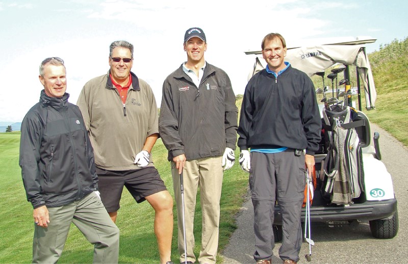 Board chair Bruce Pettigrew (second from the left) stops to pose for a photo at last year&#8217;s Links to Learning charity golf tournament held on Aug. 23. The tournament