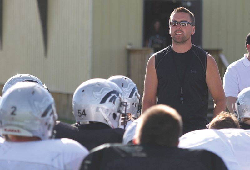 Mustangs head coach Brent Legault speaks to his players during fall practice at George McDougall, Aug. 24. The team was within one game of making provincials last season and