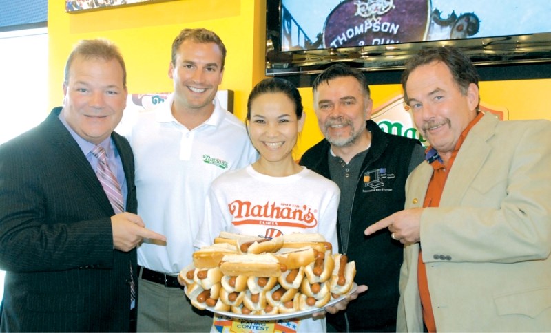 Airdrie Mayor Peter Brown, owner Blair Christiansen, Sonya Thomas &#8211; a.k.a. the Black Widow &#8211; current women&#8217;s champion of the Nathan&#8217;s Famous Hot Dog