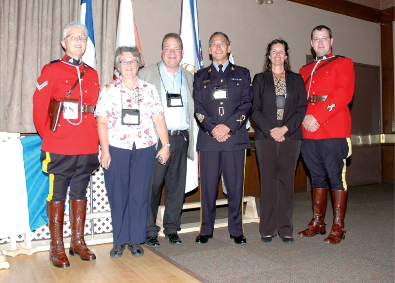 Numerous dignitaries took part in the opening ceremonies for the Alberta Citizens On Patrol Association annual general meeting and workshop, held at the Town and Country