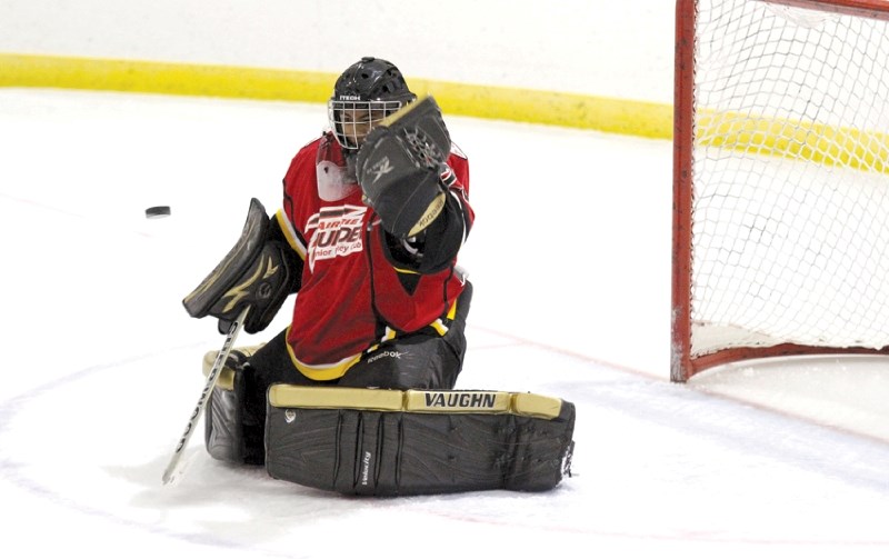 Adam Griffith stares down a shot, as his Airdrie Thunder defeated the Coaldale Copperheads 6-4, Sept. 30.