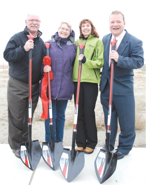 Laurence Ray of Airdrie Faith Build; Leslie Tamagi, CEO and president of Habitat for Humanity Calgary; Linda Ray, founder of Airdrie Faith Build; and Mayor Peter Brown