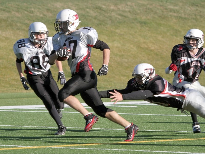 Storm running back Jordan Baldwin takes off on one of his six touchdown runs during Airdrie&#8217;s 50-20 win over the Calgary Falcons, Oct. 8.