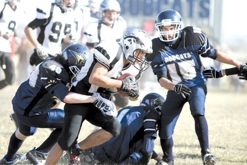 Mustangs&#8217; running back Josh Duazo looks determined to gain yardage during George McDougall&#8217;s 20-14 win over the Bow Valley Bobcats in Cochrane on Oct. 15. Duazo