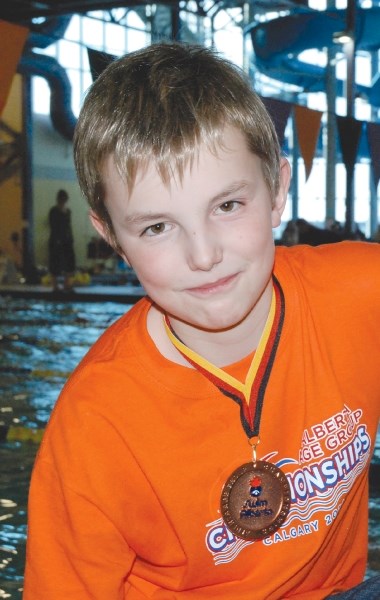 Airdrie swimmer Ethan Smith won a bronze medal in the 200-metre backstroke at the Age Group Provincial Championships, March 10 at the Talisman Centre in Calgary.