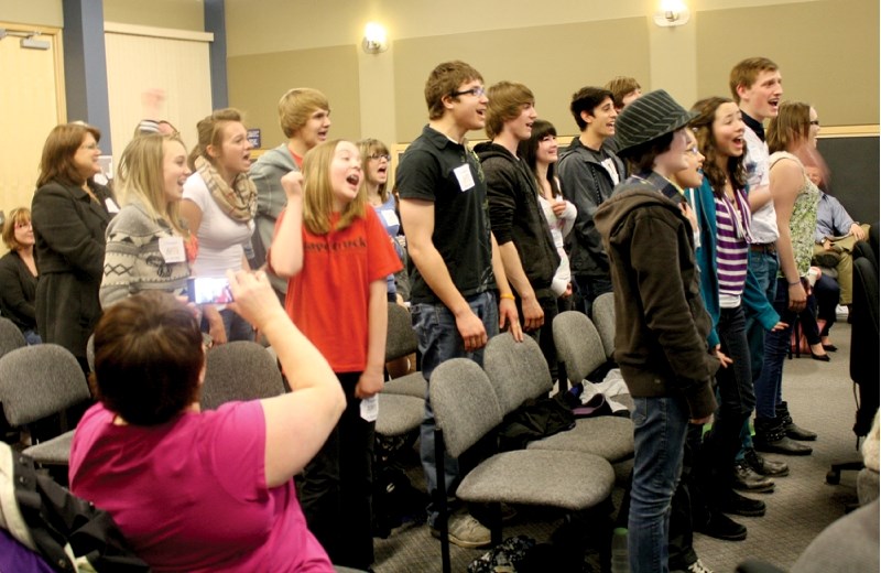A group of youth singers belted out Queen&#8217;s Bohemian Rhapsody during the April 17 City council meeting. The group attended the event to show its support for the 2013